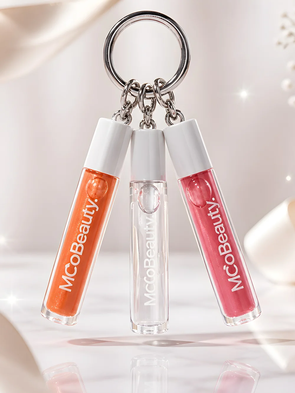 MCoBeuty Trio Lip Gloss Keychain — Clear, Coral Orange & Pink